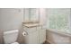 Bathroom featuring white cabinets, granite countertop, and a large window at 11530 Galashiels Dr, Huntersville, NC 28078