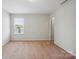 Bright bedroom with neutral walls, carpet, and windows providing natural light at 11530 Galashiels Dr, Huntersville, NC 28078