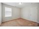 Bedroom with neutral carpet, white walls and a single window with blinds at 11530 Galashiels Dr, Huntersville, NC 28078
