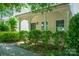 Close up of the home's front porch, showcasing the architectural details and landscaping at 11530 Galashiels Dr, Huntersville, NC 28078