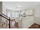 Open-concept kitchen with stainless appliances, granite countertops, and dark hardwood flooring at 11530 Galashiels Dr, Huntersville, NC 28078