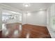 An open-concept living area with gleaming wood floors and modern finishes at 11530 Galashiels Dr, Huntersville, NC 28078