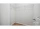 Empty walk-in closet with wire shelving and neutral carpeting at 11530 Galashiels Dr, Huntersville, NC 28078