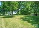 Expansive yard with mature trees at 11530 Galashiels Dr, Huntersville, NC 28078