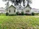 Home's back exterior featuring a large yard with a grassy lawn at 11647 Baystone Pl, Concord, NC 28025