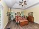 Comfortable bedroom with vaulted ceiling, wood floors, natural light, and decorative furnishings at 11647 Baystone Pl, Concord, NC 28025