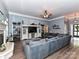 Bright living room with large sectional sofa, entertainment center, fireplace, and lots of natural light at 11647 Baystone Pl, Concord, NC 28025