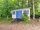Exterior view of the shed with blue doors and ramp at 11647 Baystone Pl, Concord, NC 28025