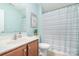 Bathroom with wood cabinets, single sink and shower/tub combination at 1244 Tranquil Falls Ln, Matthews, NC 28104