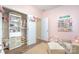 Spacious Bedroom with closet organizers and shelving filled with baby clothes and accessories at 1244 Tranquil Falls Ln, Matthews, NC 28104