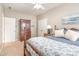 Bedroom with carpet, wood furniture, queen bed and view to other rooms at 1244 Tranquil Falls Ln, Matthews, NC 28104