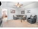 Bonus room features vaulted ceiling with ceiling fan, carpet and ample natural light at 1244 Tranquil Falls Ln, Matthews, NC 28104