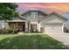 Charming single-Gathering home with a well-manicured lawn, inviting front porch, and two-car garage at 1244 Tranquil Falls Ln, Matthews, NC 28104