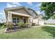 Charming single-Gathering home with a well-manicured lawn, inviting front porch, and two-car garage at 1244 Tranquil Falls Ln, Matthews, NC 28104