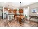 Modern eat-in kitchen featuring a center island with bar stool seating at 1244 Tranquil Falls Ln, Matthews, NC 28104