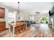 Spacious open-concept living room with hardwood floors and natural light at 1244 Tranquil Falls Ln, Matthews, NC 28104