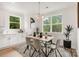 Bright dining room with a large window and modern decor at 12744 Susanna Dr, Charlotte, NC 28214