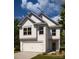 Charming two-story home featuring classic white siding and a welcoming two-car garage at 12744 Susanna Dr, Charlotte, NC 28214