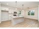 Bright eat-in kitchen with stainless appliances and a central island at 12744 Susanna Dr, Charlotte, NC 28214