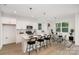 An eat-in kitchen with stainless appliances, lots of light, and a dining area at 12744 Susanna Dr, Charlotte, NC 28214