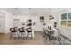 Bright eat-in kitchen with a large island, modern appliances, and dining area at 12744 Susanna Dr, Charlotte, NC 28214