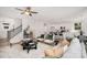 Bright, open-concept living space with a staircase and kitchen in the background at 12744 Susanna Dr, Charlotte, NC 28214