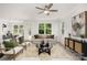 Light-filled living room with large windows and stylish furnishings at 12744 Susanna Dr, Charlotte, NC 28214