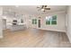 Open-concept living space with views of the kitchen island and modern fixtures at 12744 Susanna Dr, Charlotte, NC 28214