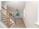 Open-concept living space with modern staircase and views of the exterior at 12744 Susanna Dr, Charlotte, NC 28214