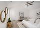 Spacious main bedroom with high ceilings, stylish decor, and comfortable seating area at 12744 Susanna Dr, Charlotte, NC 28214