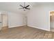 Spacious main bedroom with high ceilings, ceiling fan, and ensuite bathroom access at 12744 Susanna Dr, Charlotte, NC 28214