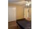 Well-lit bedroom featuring hardwood floors, a ceiling fan, and a closet at 1326 5Th Ne St, Hickory, NC 28601