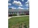 Charming brick townhouse with a well-manicured lawn and lovely turquoise shutters and front door at 1326 5Th Ne St, Hickory, NC 28601