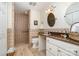 Bathroom featuring tiled walk-in shower, modern vanity, and stylish fixtures at 14027 Springwater Dr, Matthews, NC 28105