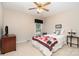 Bedroom with a star quilt, ceiling fan, and window at 14027 Springwater Dr, Matthews, NC 28105