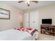 Cozy bedroom featuring double closets and a TV at 14027 Springwater Dr, Matthews, NC 28105