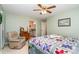 Spacious bedroom featuring a quilt bed, comfortable chair, and ensuite bathroom at 14027 Springwater Dr, Matthews, NC 28105