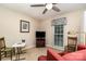 Living room with red sofa, TV, and a game table at 14027 Springwater Dr, Matthews, NC 28105