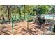 Community playground with swings, slides, and recreational facilities by the community lake at 14027 Springwater Dr, Matthews, NC 28105
