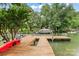 Wooden dock on a lake with space for a kayak and motorboat at 147 Bluewing Ln # 274, Mooresville, NC 28117