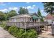 Charming home featuring a spacious deck with outdoor seating and lush landscaping at 147 Bluewing Ln # 274, Mooresville, NC 28117