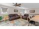 Comfortable living area featuring leather furniture, neutral walls, and a ceiling fan at 147 Bluewing Ln # 274, Mooresville, NC 28117