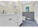 Well-lit bathroom featuring a double vanity, modern mirrors and a separate shower and tub at 1501 E Church St, Cherryville, NC 28021