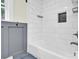 Clean, neutral bathroom featuring modern white subway tile in shower and tub area at 1501 E Church St, Cherryville, NC 28021