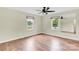 Neutral bedroom features hardwood floors, two windows and a ceiling fan at 1501 E Church St, Cherryville, NC 28021