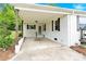 Charming carport with stained wood supports and painted white brick on a well-maintained home at 1501 E Church St, Cherryville, NC 28021