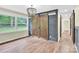 Bright dining area featuring hardwood floors, a window and a rustic sliding barn door at 1501 E Church St, Cherryville, NC 28021