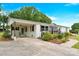 Wide angle view of single story home featuring a white brick exterior and covered parking at 1501 E Church St, Cherryville, NC 28021