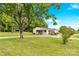 Home with a sprawling front yard and mature trees, providing a serene and inviting atmosphere at 1501 E Church St, Cherryville, NC 28021