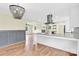 Open kitchen featuring granite countertops, modern stainless appliances and bright lighting at 1501 E Church St, Cherryville, NC 28021
